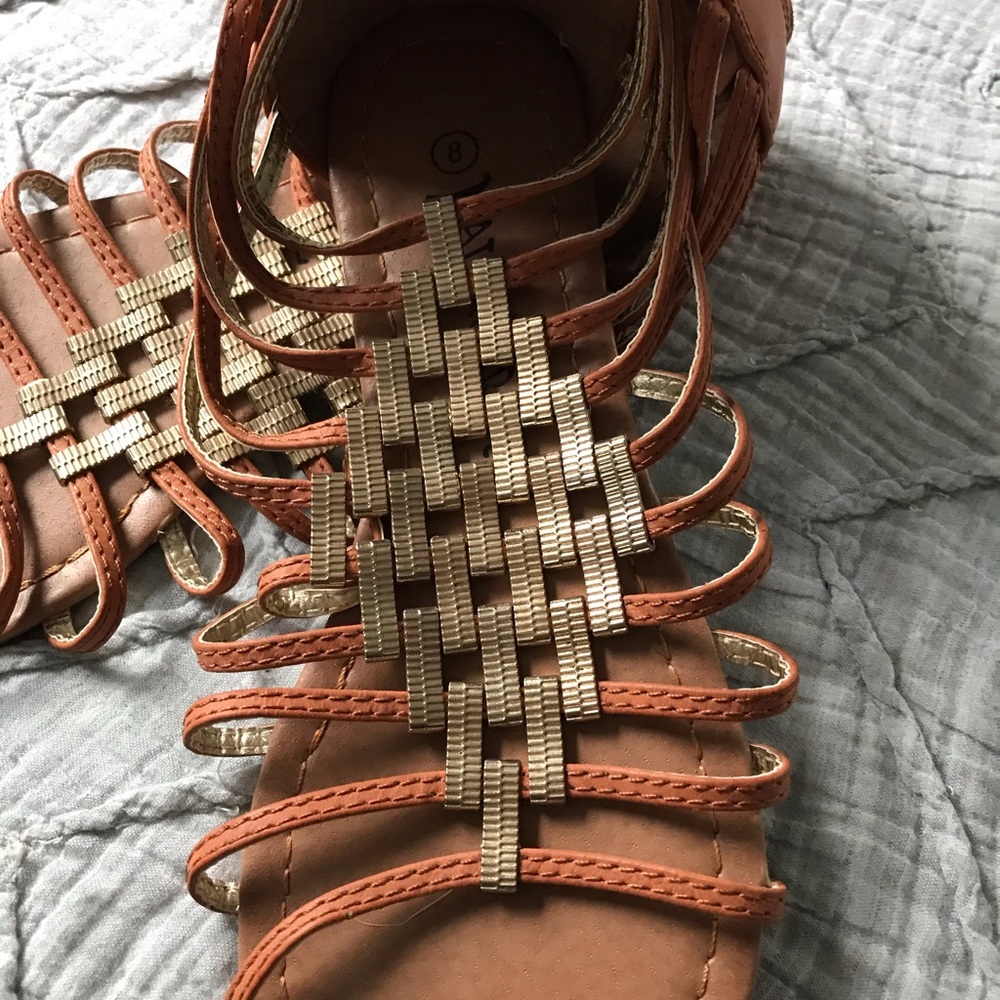 Tan sandals with gold detail